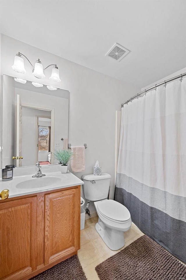 full bathroom with visible vents, toilet, curtained shower, tile patterned flooring, and vanity