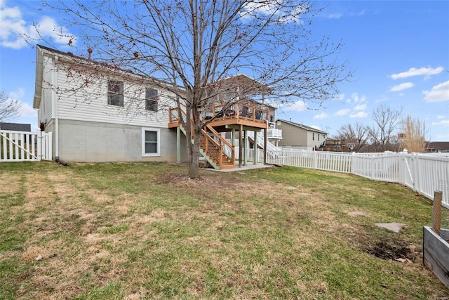 back of house featuring stairs, a yard, a fenced backyard, and a wooden deck