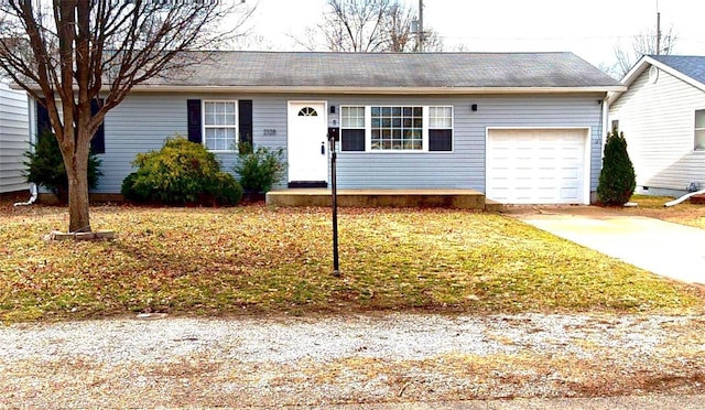 ranch-style house with an attached garage and concrete driveway