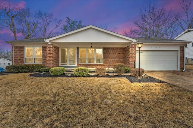 ranch-style house featuring brick siding and an attached garage