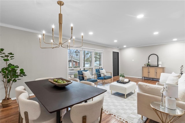 dining area with light wood-type flooring, baseboards, crown molding, and recessed lighting