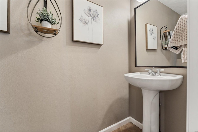 bathroom with baseboards