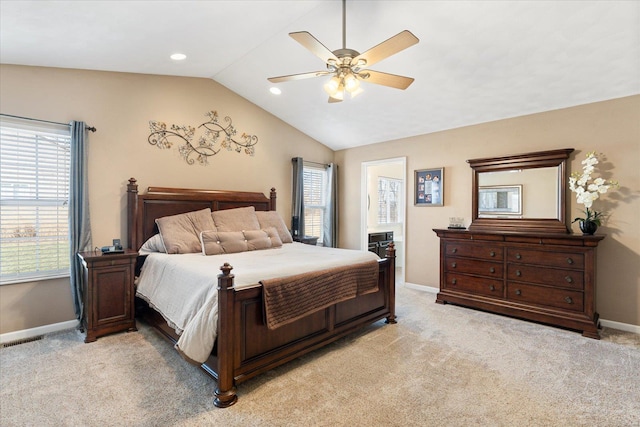 bedroom featuring vaulted ceiling, multiple windows, and light carpet