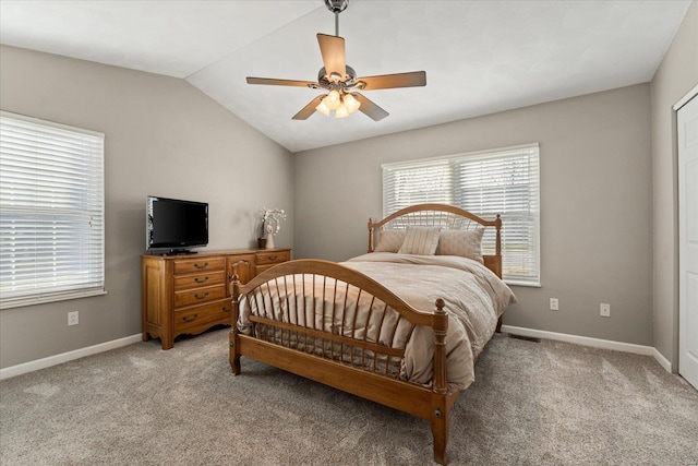 bedroom with a ceiling fan, lofted ceiling, light carpet, and baseboards