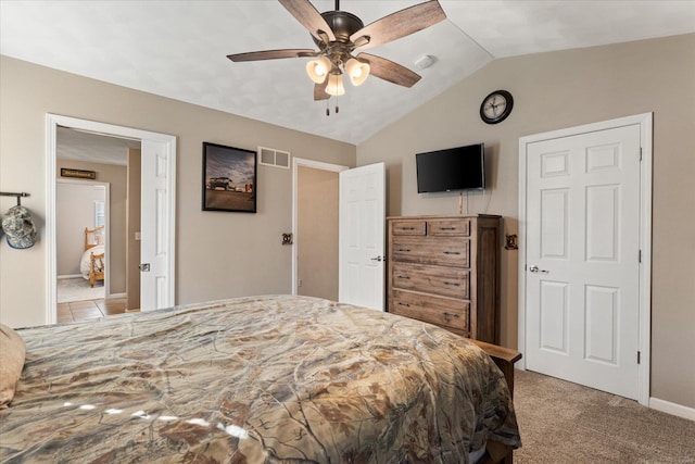 bedroom featuring lofted ceiling, visible vents, a ceiling fan, carpet flooring, and baseboards