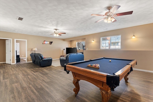 rec room with ceiling fan, baseboards, a textured ceiling, and wood finished floors