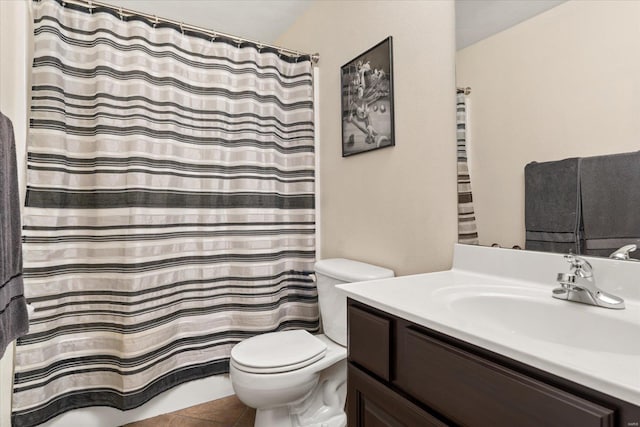 full bath featuring toilet, tile patterned flooring, and vanity