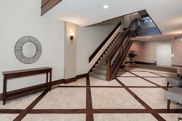 interior space featuring marble finish floor, recessed lighting, and baseboards