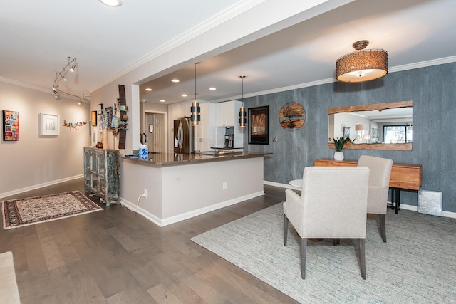 dining room featuring baseboards, ornamental molding, dark wood finished floors, and recessed lighting