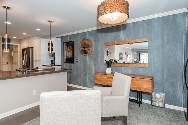 dining area with baseboards, recessed lighting, wood finished floors, and crown molding