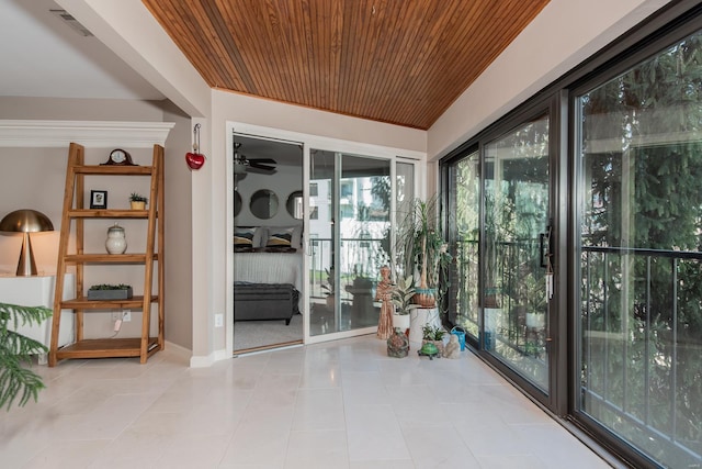 interior space featuring tile patterned flooring and wood ceiling