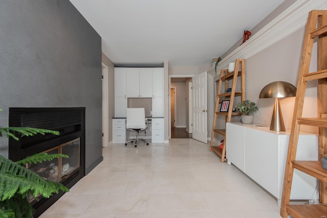 interior space with a glass covered fireplace