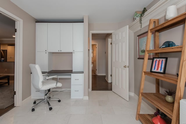 office featuring light tile patterned floors and baseboards