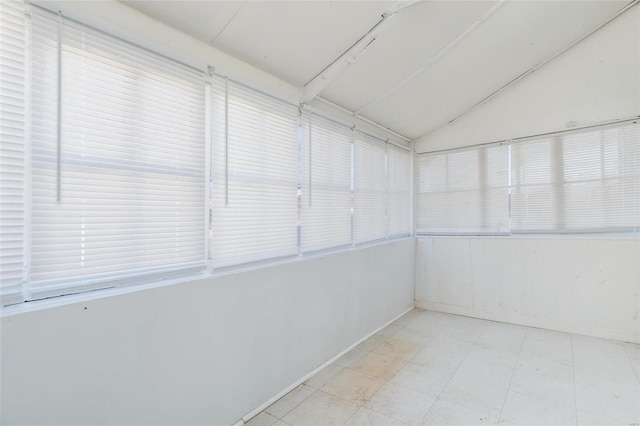 unfurnished sunroom with vaulted ceiling