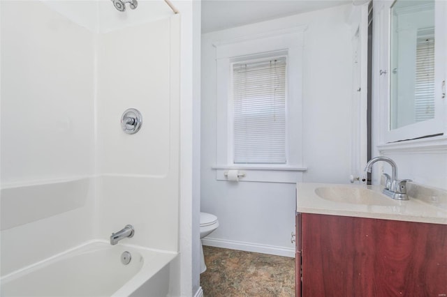 full bath with baseboards, vanity, toilet, and shower / bathtub combination