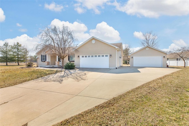 ranch-style home with a garage, fence, and a front yard