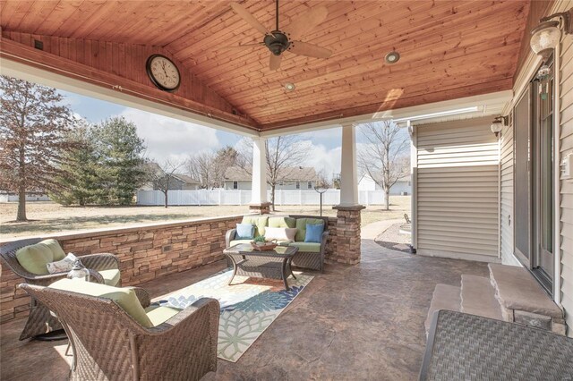 view of patio featuring ceiling fan, an outdoor living space, and fence