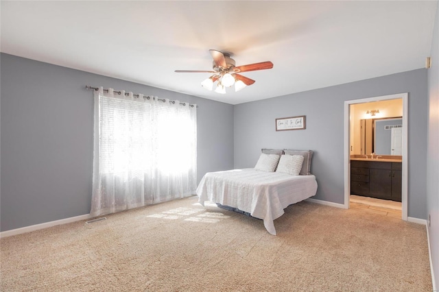 bedroom with ceiling fan, connected bathroom, visible vents, baseboards, and carpet