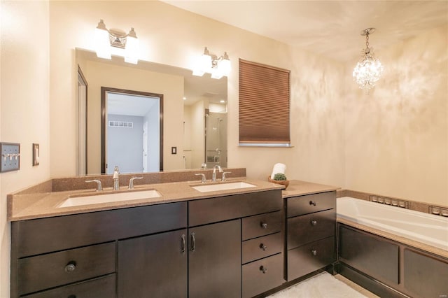 full bathroom featuring visible vents, a sink, a bath, and double vanity