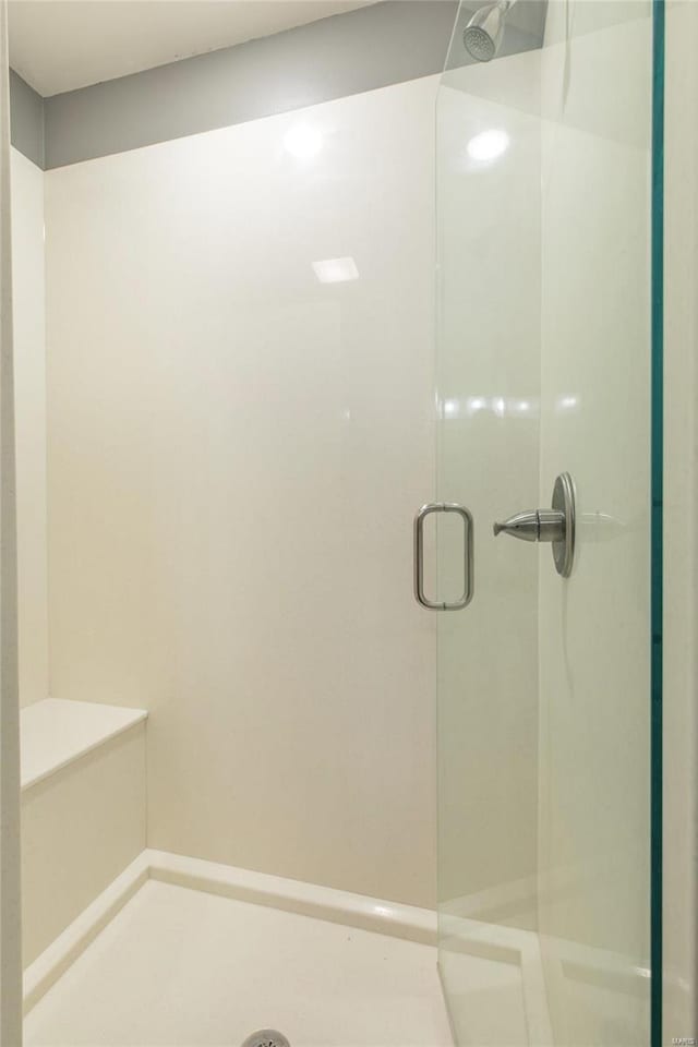 full bathroom featuring a stall shower