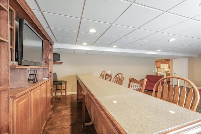 dining area with recessed lighting, concrete floors, and baseboards