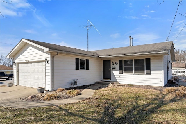 ranch-style home featuring a garage, driveway, and a front yard