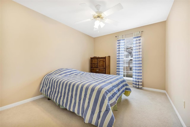 bedroom featuring ceiling fan, baseboards, and carpet flooring