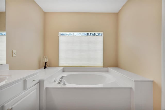 full bathroom featuring vanity and a bath