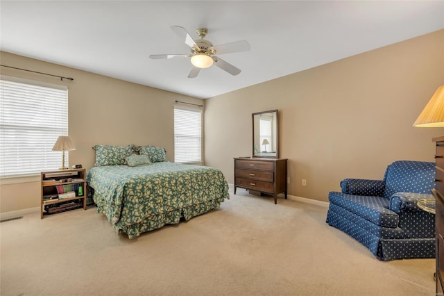 bedroom with ceiling fan, carpet, visible vents, and baseboards