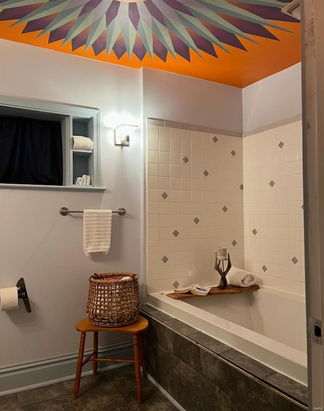 bathroom with tiled shower / bath and tile patterned floors