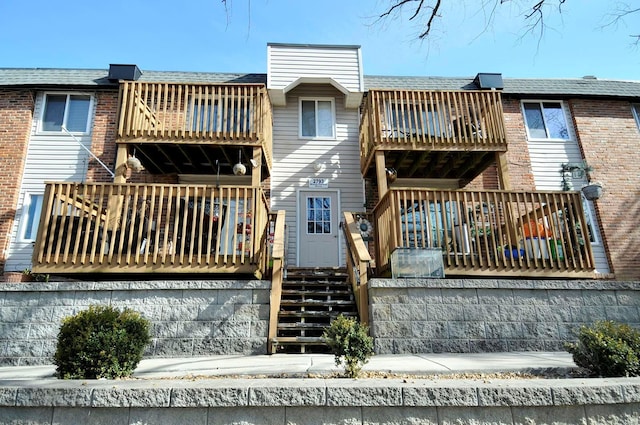 back of house with a balcony