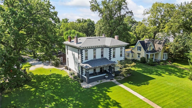 exterior space with a lawn and a chimney