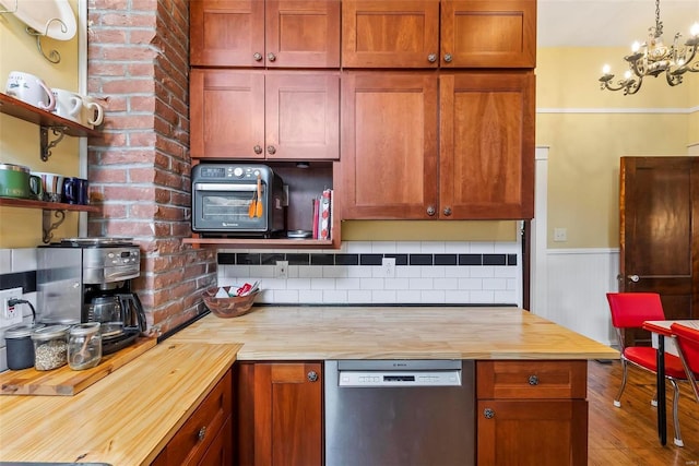 kitchen with wood finished floors, wood counters, dishwasher, open shelves, and tasteful backsplash