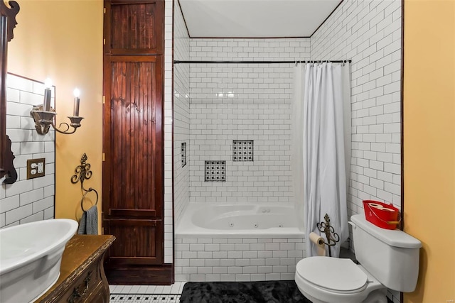 full bath featuring tile patterned flooring, toilet, vanity, tile walls, and a combined bath / shower with jetted tub