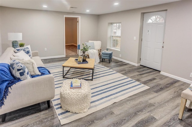 living room featuring recessed lighting, visible vents, baseboards, and wood finished floors