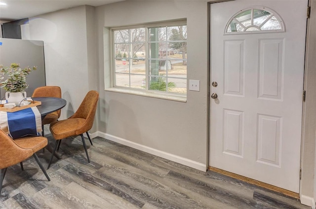 entrance foyer featuring wood finished floors and baseboards