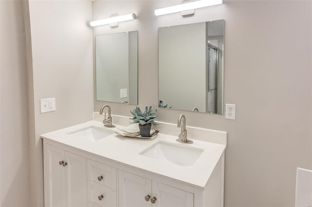 full bath with a sink and double vanity