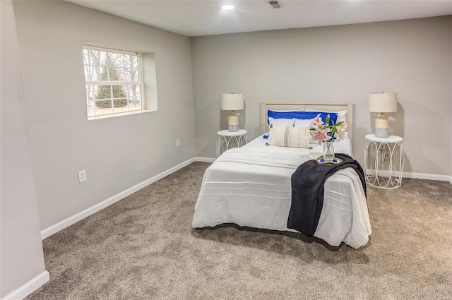 carpeted bedroom featuring recessed lighting, visible vents, and baseboards