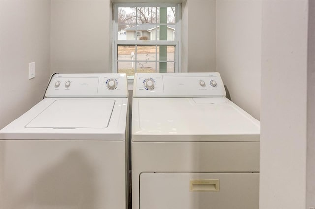 washroom featuring laundry area and washing machine and clothes dryer