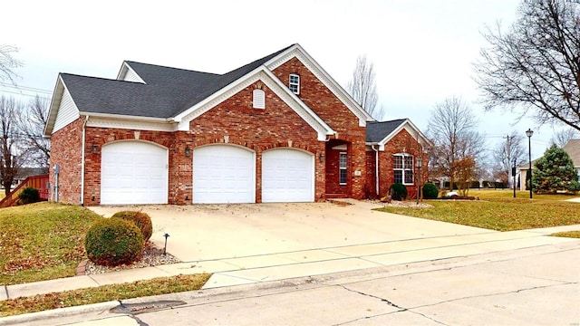 view of front of home featuring a garage, brick siding, driveway, roof with shingles, and a front lawn