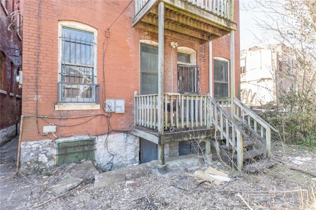 property entrance with brick siding