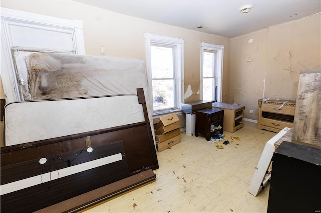 bedroom featuring light floors