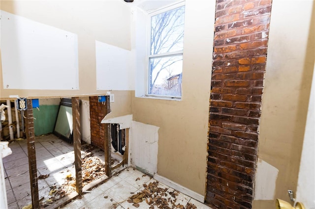 miscellaneous room featuring light tile patterned floors