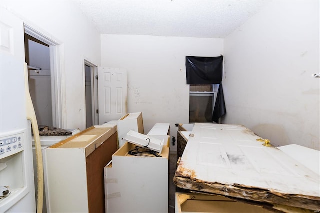 bedroom featuring a textured ceiling