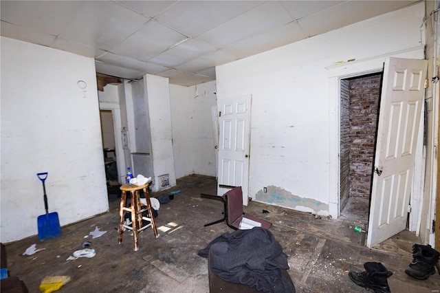 interior space with a drop ceiling and visible vents