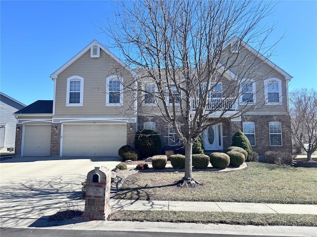 view of front of property featuring a garage, a front yard, brick siding, and driveway