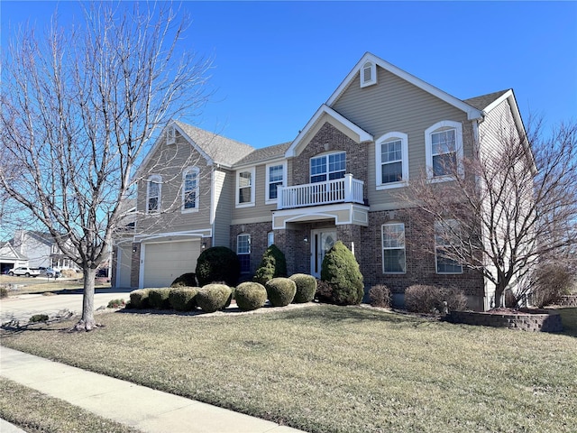 view of front facade featuring brick siding, a front yard, a balcony, a garage, and driveway