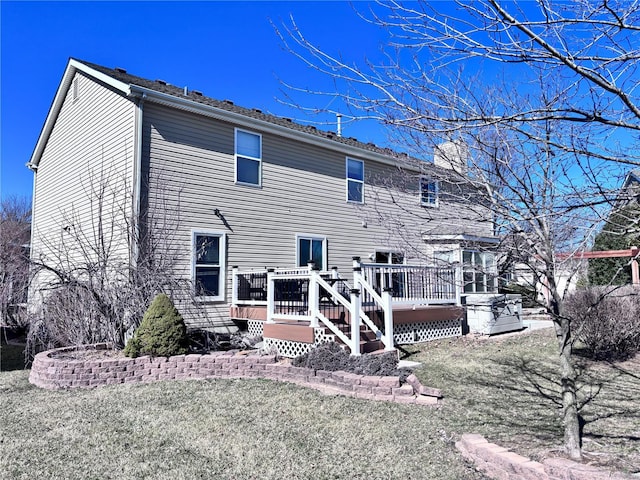 rear view of property with a deck