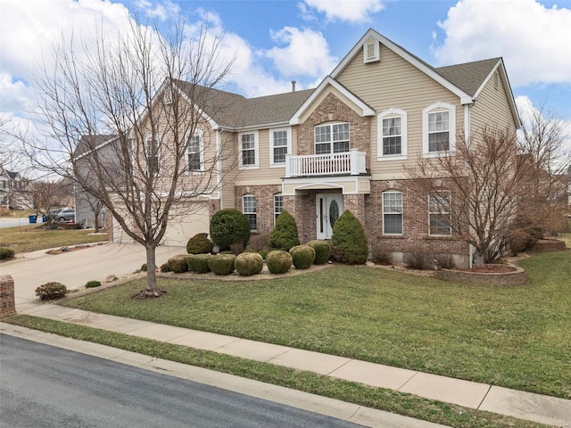 view of front facade featuring driveway, brick siding, a front lawn, and a balcony