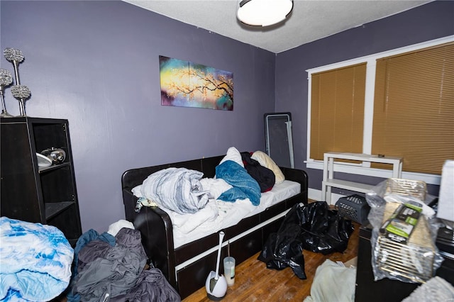 bedroom featuring wood finished floors